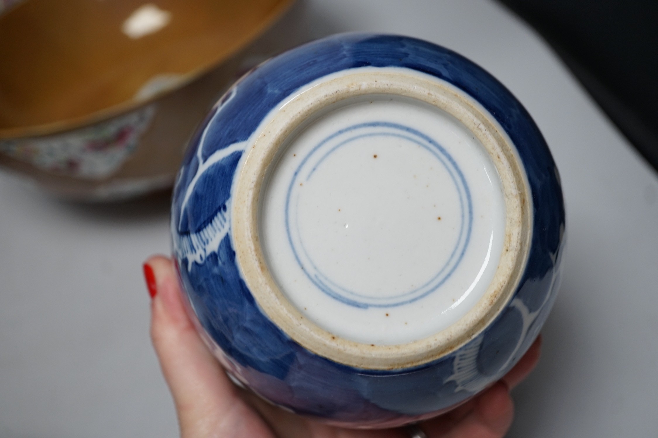 A group of Japanese and Chinese ceramics to include two blue and white jars, a wucai bowl etc.